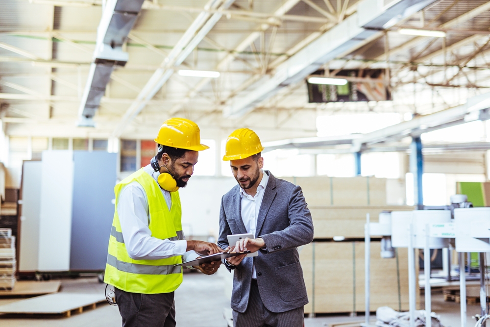 Engineer reviewing simulation data to support a capital investment decision on-site
