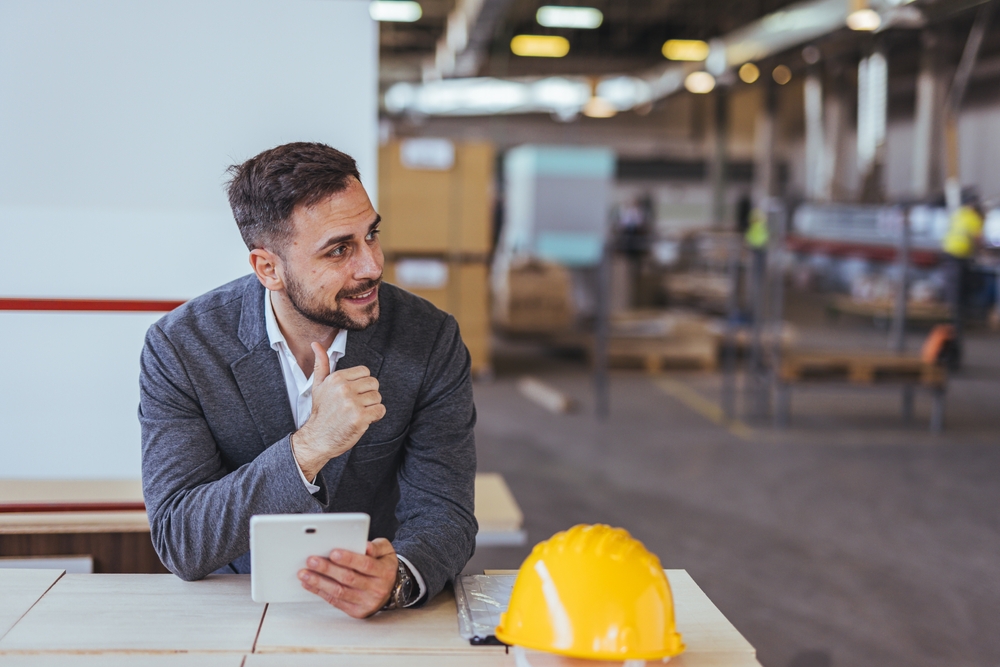 Plant manager reviewing capital investment decision outcomes
