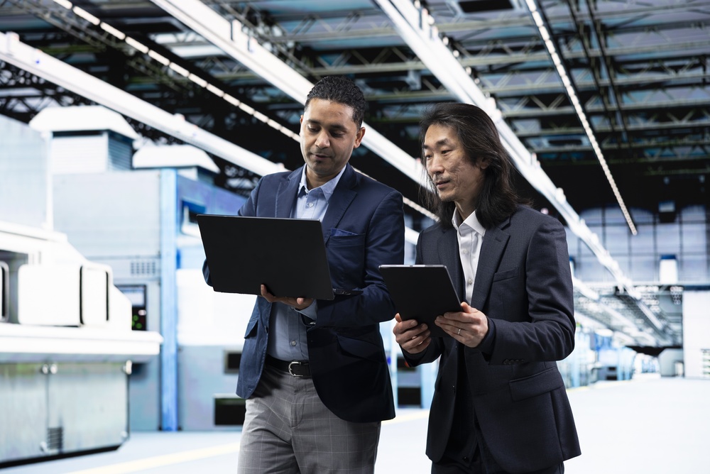 Operations executives analyzing capital investment decisions using a digital twin dashboard
