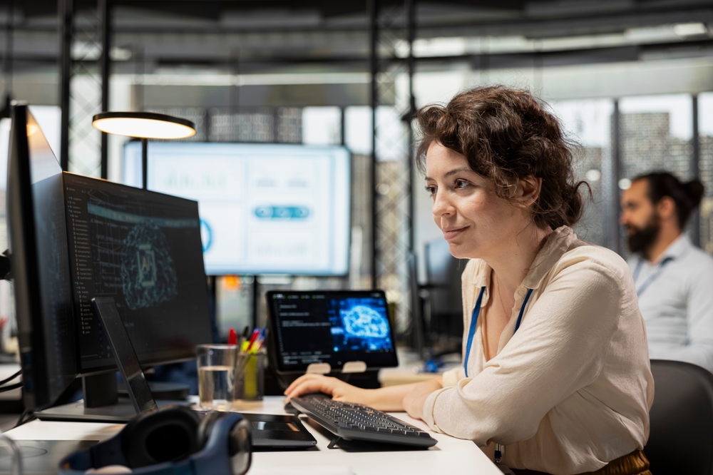 Professional reviewing business performance dashboards on a laptop as part of a process optimization initiative to streamline operations.
