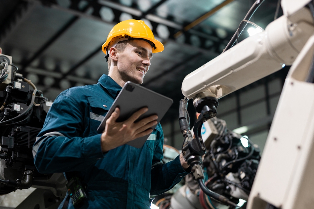 Engineering manager assessing capacity with digital twin technology on site.

