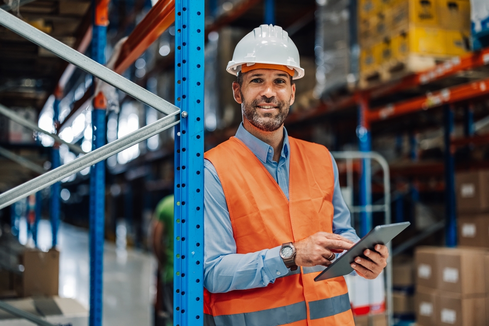 Operations manager reviewing resource allocation data on a digital dashboard
