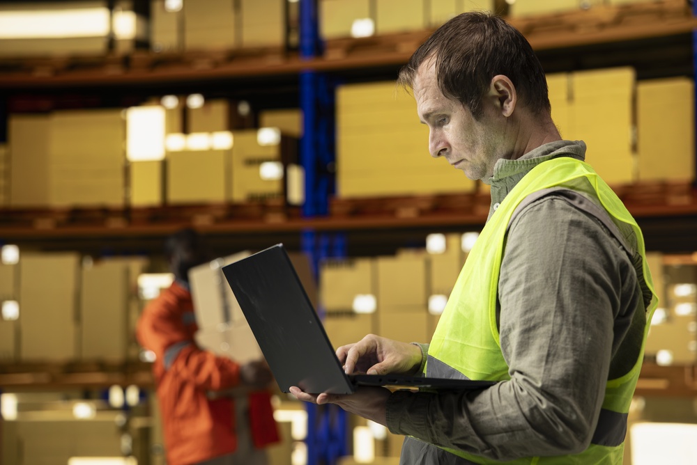 Operations manager evaluating scenario planning results for warehouse scheduling
